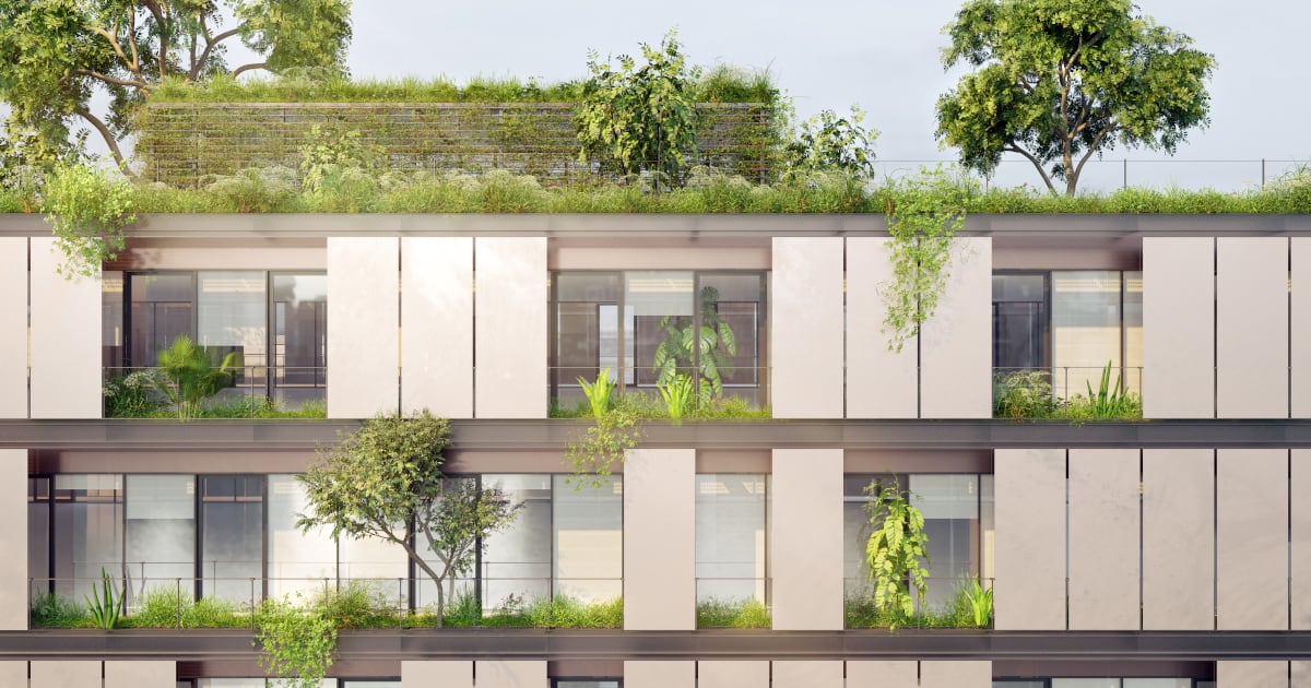 Un moderno edificio risanato energeticamente con tetto verde e pannelli solari 