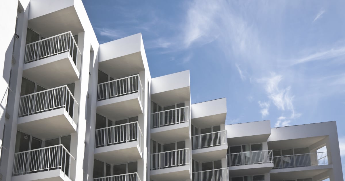 White apartment block with balconies